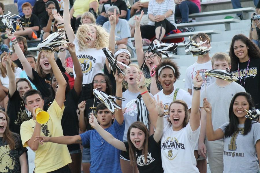 The Topeka High student section cheering on their Trojans.