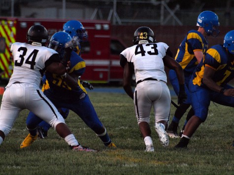 Kevon Seats, senior (34), and Brian Collins (43), senior, getting into the backfield.