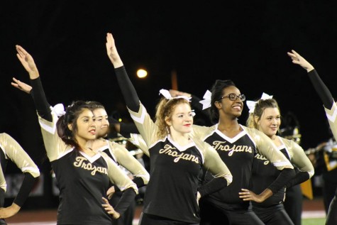 The Trojan Dance Team strikes a pose as they finish their dance routine Friday night at the halftime show.