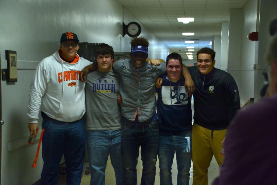 (From left to right) Teven Jenkins, Ryan Luna, Mike McCoy, Jacob Anderson, and Dakota Williams pose for camera during the National Signing Day event at Topeka High School.