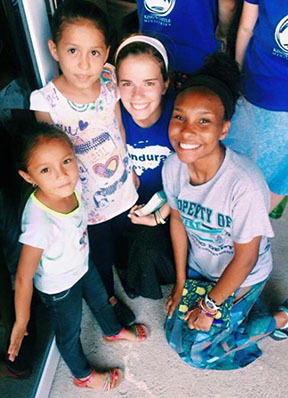 Jaide Ramirez-Jennings (right) and Tori Vaughn (left), juniors, posing with two girls they met on their trip.