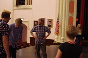 Benaiah Anderson, Stage Combat Director, works with students during a workshop