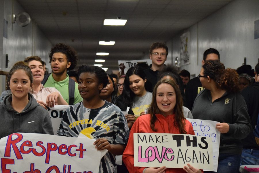 Student begin their walk with posters and a large group of students to show their unity.