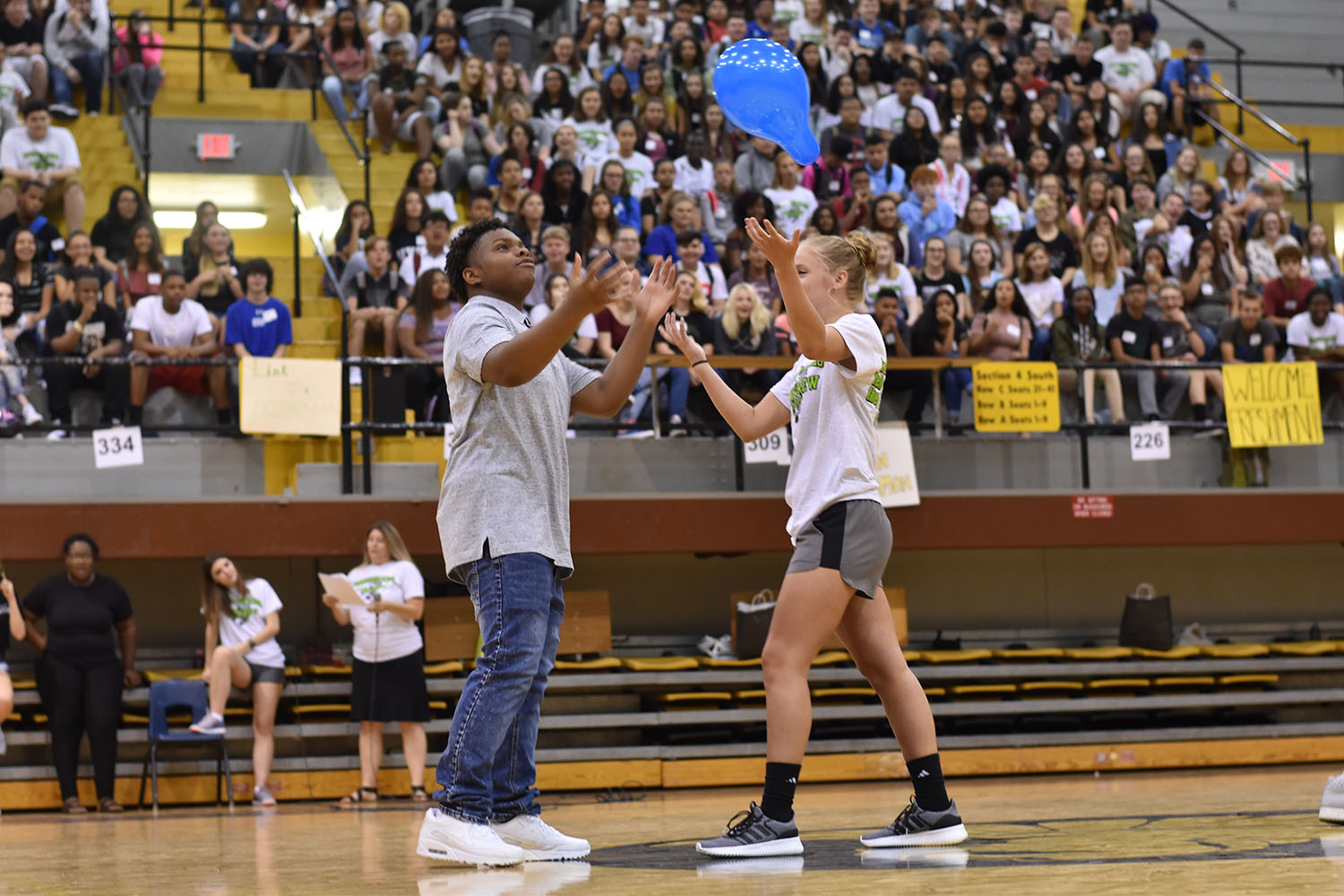 Alani Snook, senior, and David Smith, freshman, try to get the balloon in control. 