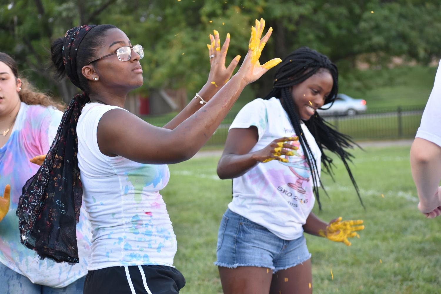 Keiana McMillian, sophomore, and Lavender Wilson, Junior, are eager to start off Color Chaos by getting paint on their hands. This is a great way to hang out with your friends and Im excited for next years color chaos, said McMillian.