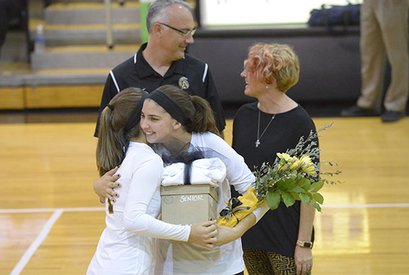 Alynne Kettler, senior, receiving flowers and gifts for the senior night celebration. 