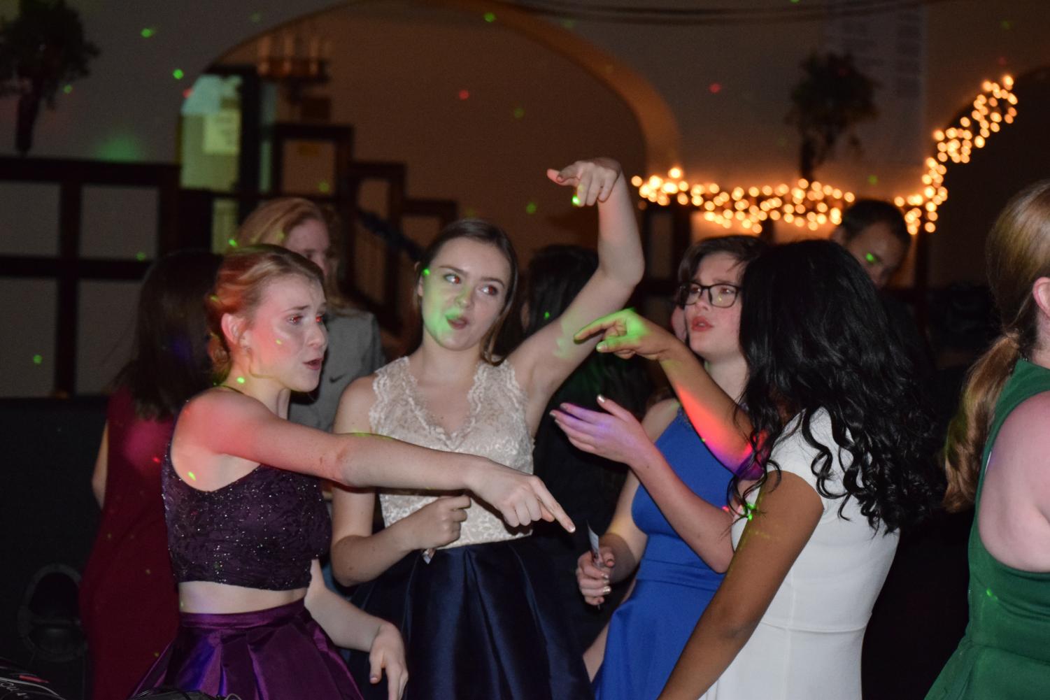 (Left to right) Sophomores, Katie Fitzgerald, Rose Pennington, Ann Beall, and Yadira Garcia dance at the 2016 Winter Semi-formal.