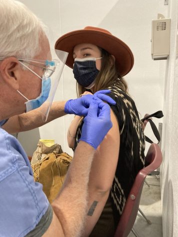 English teacher Katelynn Madl bravely takes her Covid-19 vaccination. 