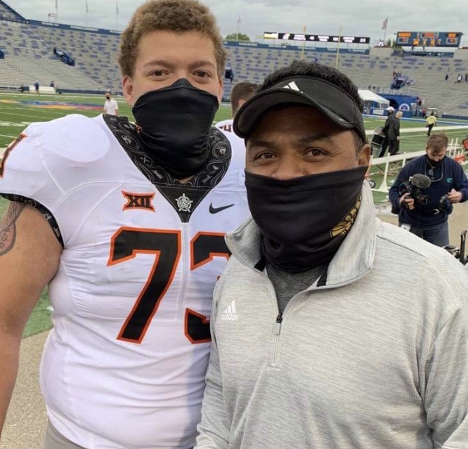 Teven Jenkins an offensive tackle for Oklahoma State ( THS class of 2016) was drafted by the Chicago Bears in the NLF draft. He is shown here with Coach Carlos Kelly, who had coached Jenkins as far back as middle school. They met up after OSU beat KU in the fall 2020 season. 