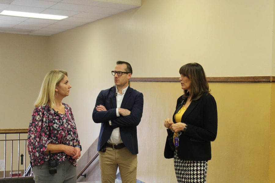 Melissa Brunner, Sean Dixon, and Rebecca Morrisey taking a tour of Topeka High. 