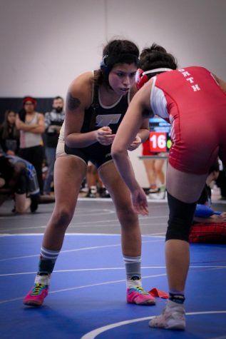 Marilena Zuniga(140 lbs) faces off against Shawnee Mission North opponent at Junction city wrestling meet