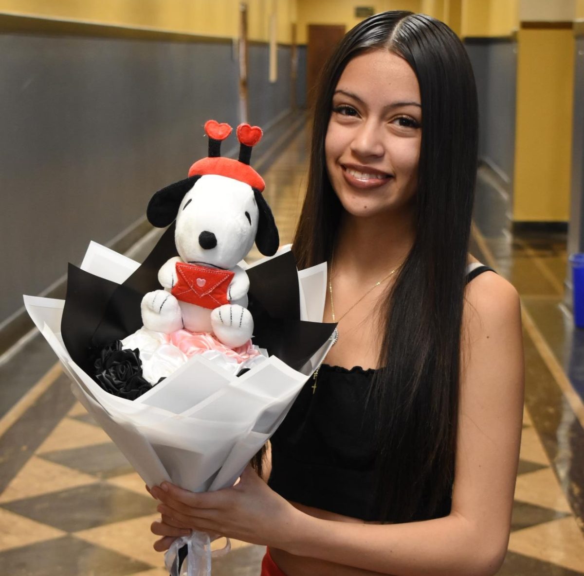 Damaris Sanchez showcasing a birthday ribbon bouquet that she handcrafted.