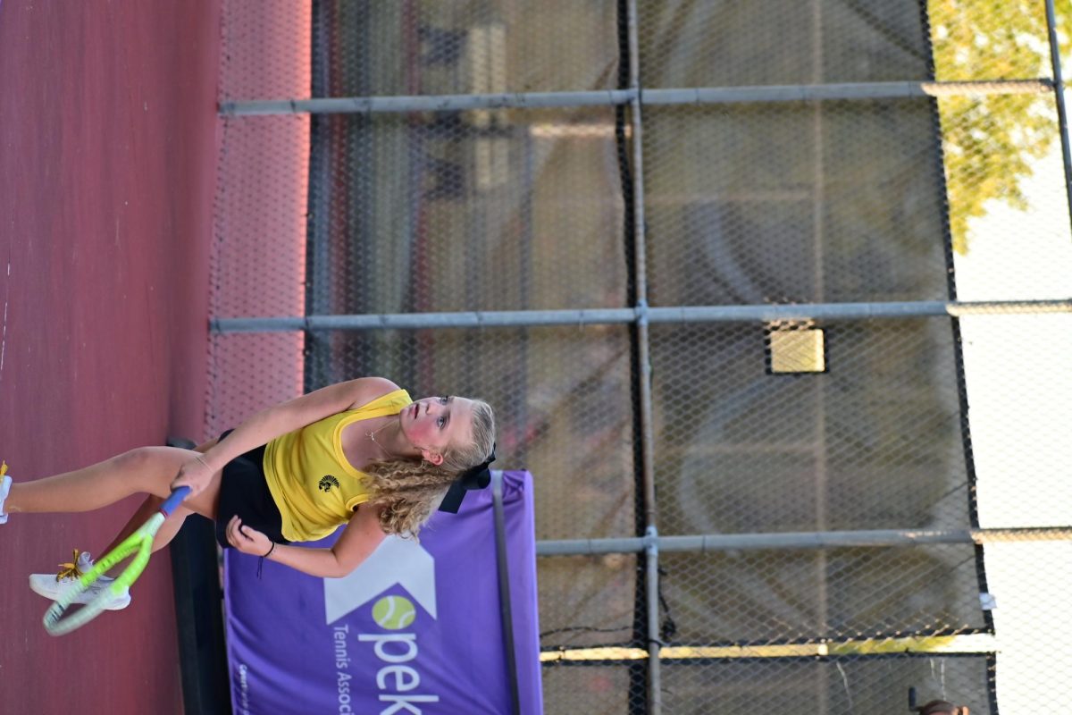 Madeline Deters, 12, the reigning centennial league tennis singles champion, watching the ball cross the net