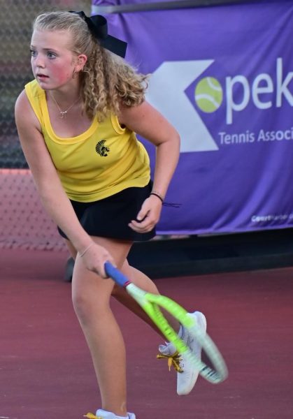 Madeline Deters, 12, the reigning centennial league tennis singles champion, watching the ball cross the net